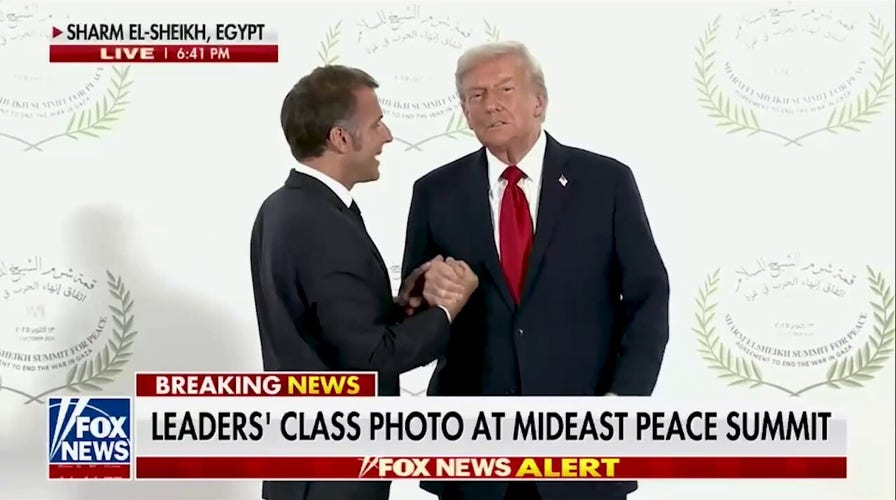 U.S. President Donald Trump and French President Emmanuel Macron share long, awkward handshake