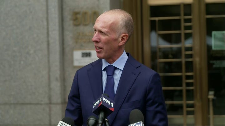 Cassie Ventura's lawyer reads statements from her and her husband outside a New York City courthouse