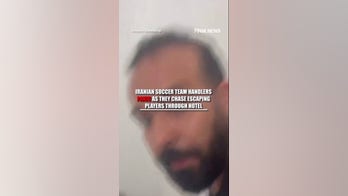 Iranian soccer team handlers PANIC as they chase escaping players through hotel