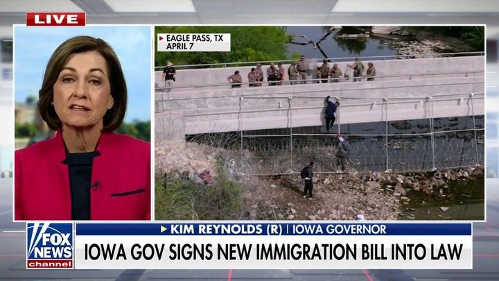 Gov. Kim Reynolds signs bill aiming to curb illegal immigration by empowering law enforcement