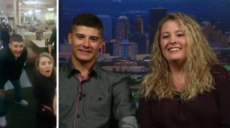 Returning Marine surprises mom by sneaking into selfie