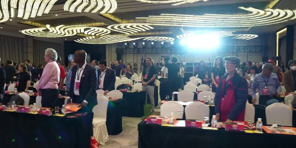 WATCH: Neville Roy Singham and conference attendees in Shanghai stand to 'The Internationale," a communist anthem