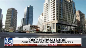 Chinese officials scrambling to deal with surge in COVID-19 cases