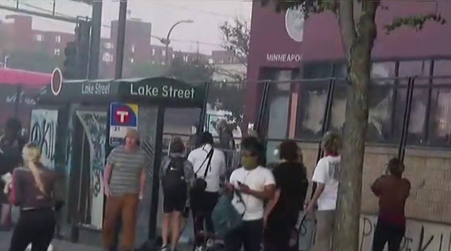 Protesters seen throwing objects at Minneapolis Third Precinct police station