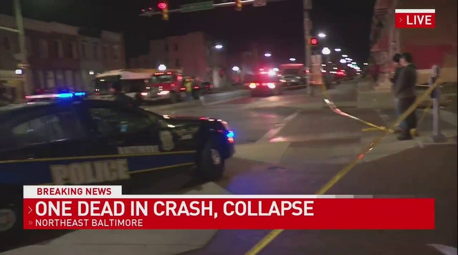 Baltimore, Maryland: Officials say a car crashed into a building causing it to partially collapse