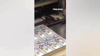 A look at the $100 bills with the Trump touch