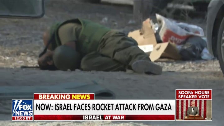 Israeli forces face rocket fire from Hamas as nearly 200 people held hostage