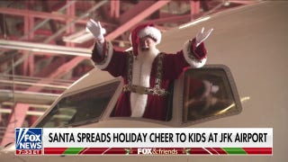Santa brings holiday cheer to kids at JFK airport - Fox News