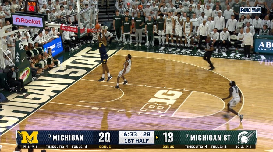 Michigan's Aday Mara blocks and throws full court pass to Morez Johnson Jr. for dunk, extending lead vs. Michigan State