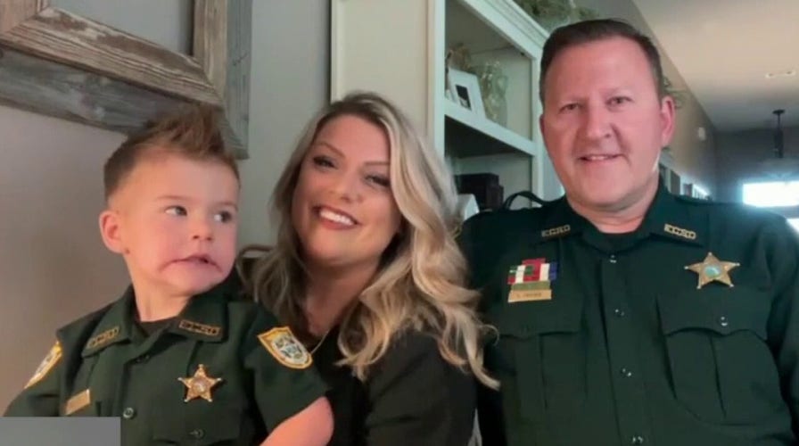 Like father, like son: Cute pics capture pint-sized officer with hero dad