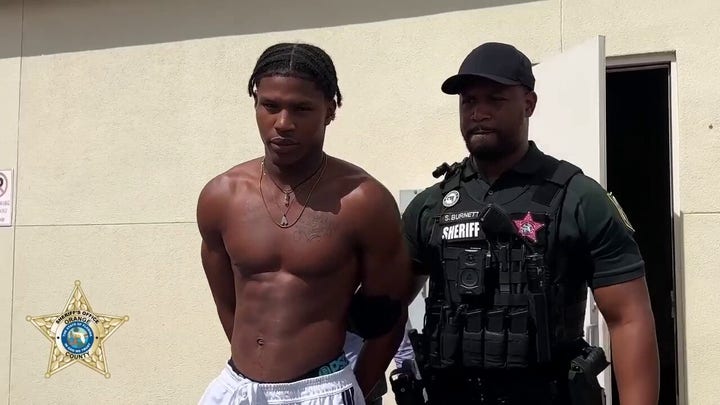 Florida trail attack suspect escorted to sheriff's cruiser