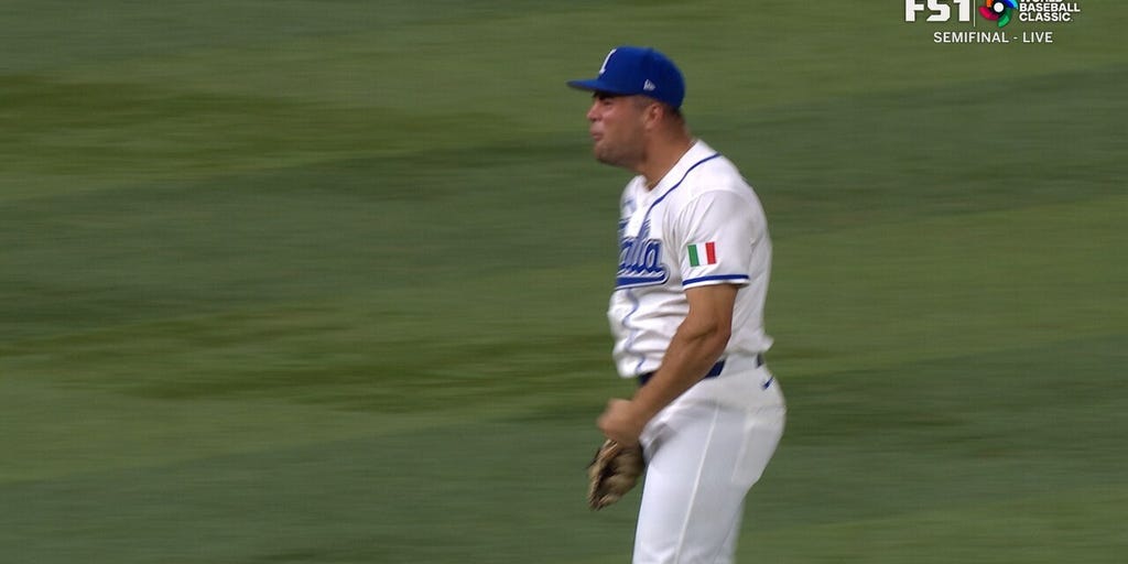Italy's Jacob Marsee catches and throws out Maikel Garcia at first to complete double play against Venezuela