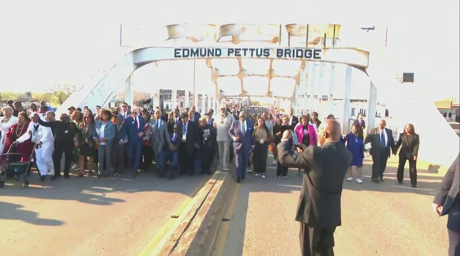 Biden marches with Sharpton in Selma