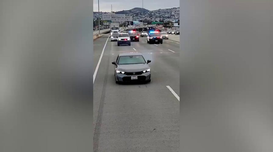 Wild Bay Bridge chase ends with suspect dangling beneath span