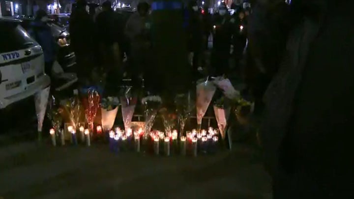 New York City's 32nd Police Precinct holds a candlelight vigil for slain officer Jason Rivera