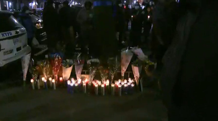 New York City's 32nd Police Precinct holds a candlelight vigil for slain officer Jason Rivera