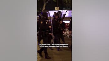Madrid police break up anti-migrant protest