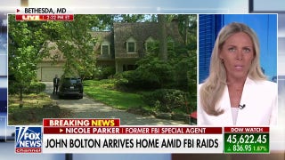 John Bolton returns home after FBI raid