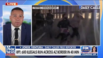 Reporter films hundreds of migrants running across Arizona border, says border agents 'feel like Uber drivers'