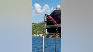 Pirate-themed tourist ship CAPSIZES as people seen jumping off boat