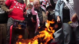 Columbia University students rip up, burn diplomas after graduating