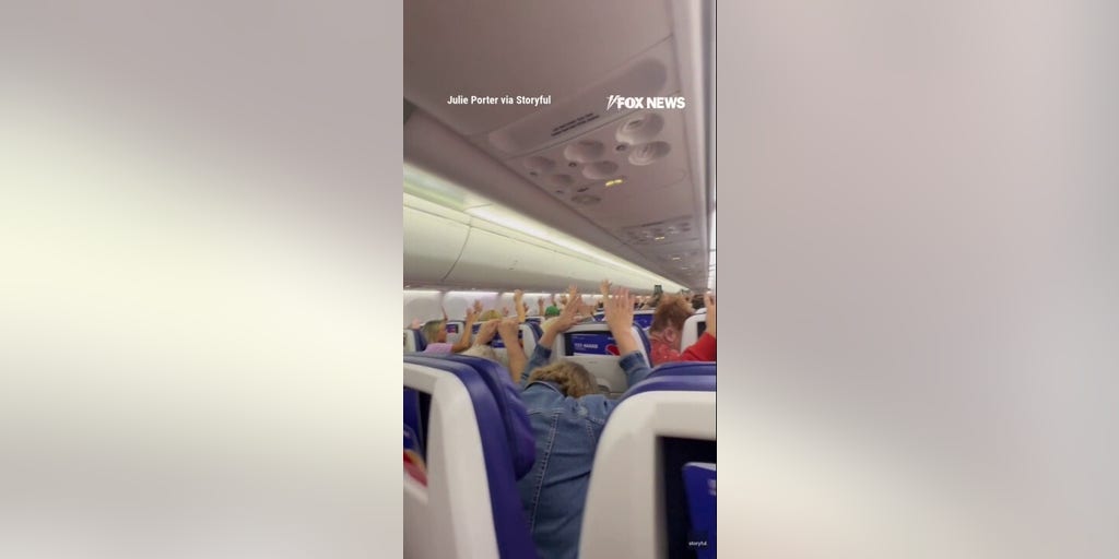 Diverted Southwest passengers hold hands up amid threat investigation
