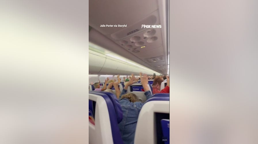 Diverted Southwest passengers clasp  hands up   amid menace  investigation