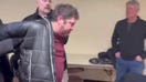 Man escorted out of press conference after appearing to use spray