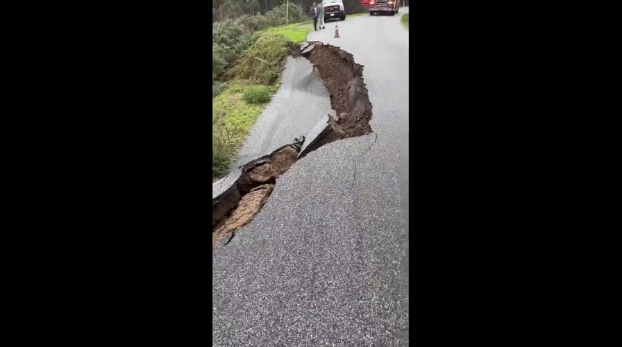 California storms Video shows road collapsing down a hill in San