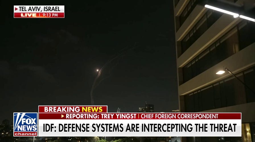 Fox News' Trey Yingst and camera crew run for cover in Israel as Iranian missiles strike