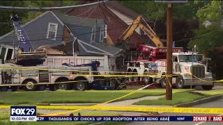Dump truck plows into NJ home after driver suffers medical emergency