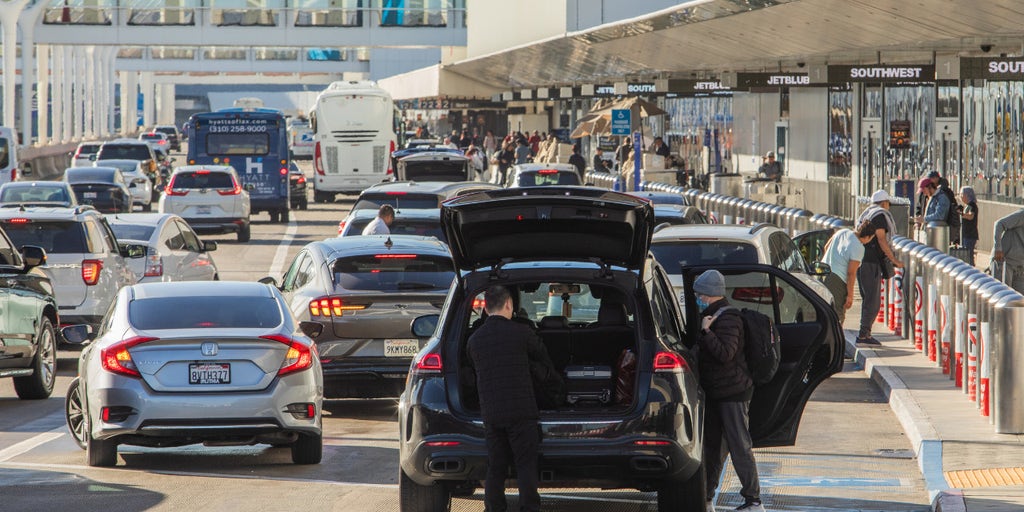 WATCH LIVE: Holiday travel rush sets records as delays mount