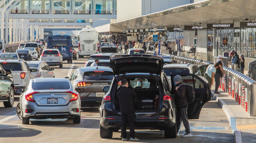 WATCH LIVE: Holiday travel rush sets records as delays mount