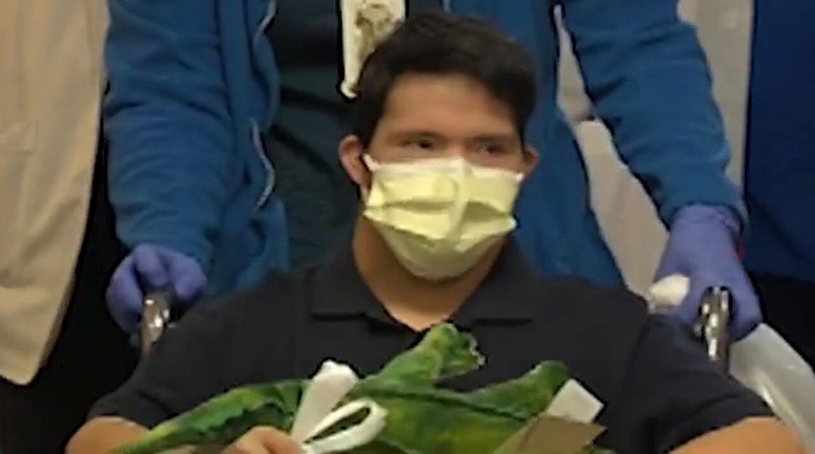 Teen with Down syndrome greeted with cheers after beating COVID-19