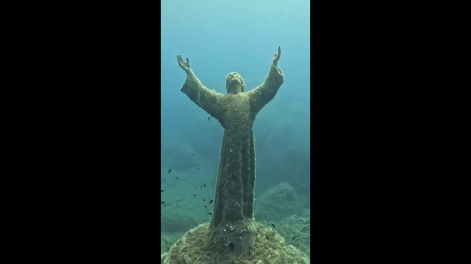 Divers scrub famed Christ of the Abyss statue during annual underwater cleanup