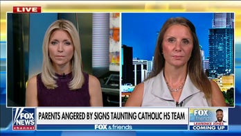 Outraged parent says school knew about 'privileged' sign at football game