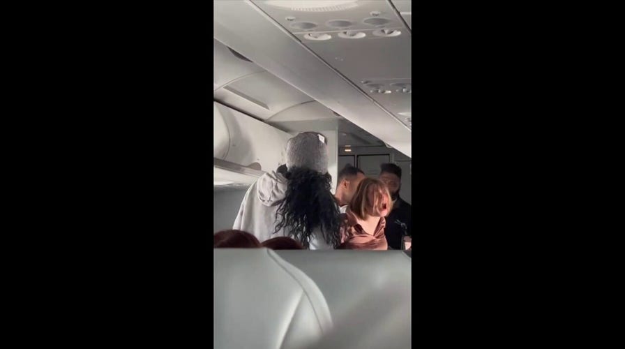 Flight descends into chaos when 'possessed' woman begins screaming, jumping over seats: 'There's a real devil'