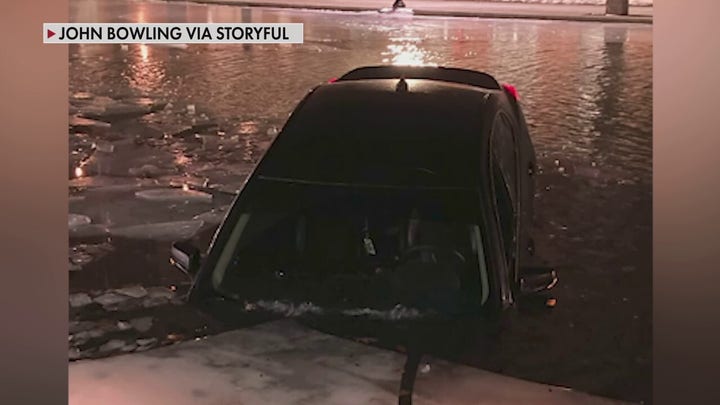 Car drives on frozen Indianapolis canal