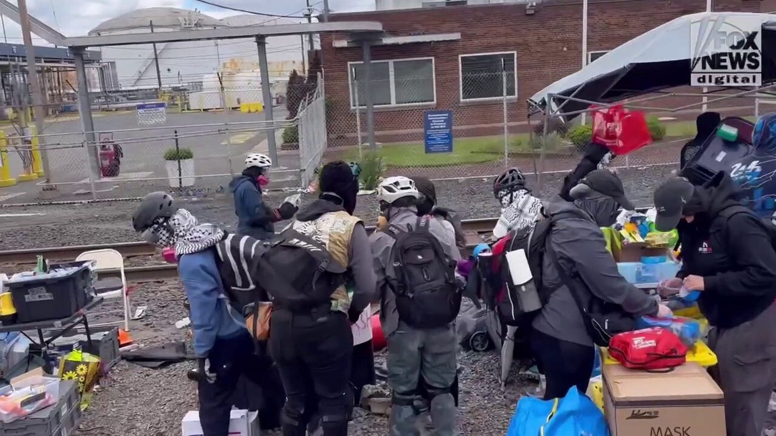Masked anti-ICE agitators try to block Fox News Digital filming Delaney Hall stockpile of masks, helmets and gear