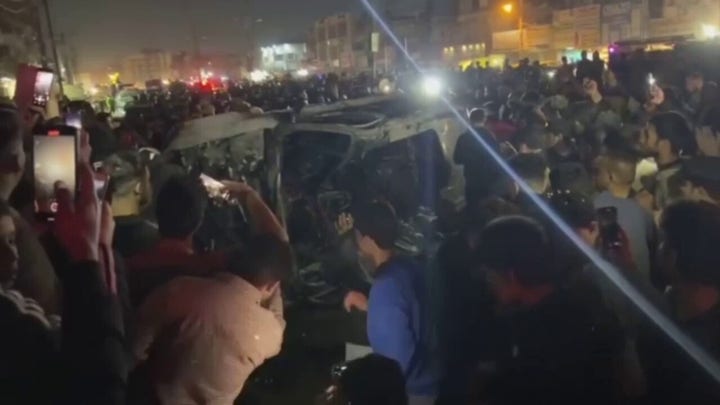 Crowds gather after US strike in Baghdad kills at least one commander of Iran-backed militia