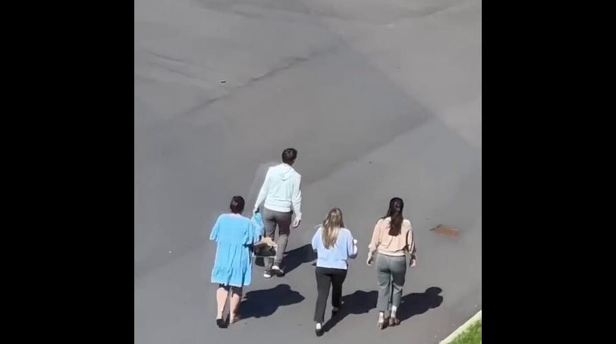 Children escorted across parking lot following school shooting n Nashville