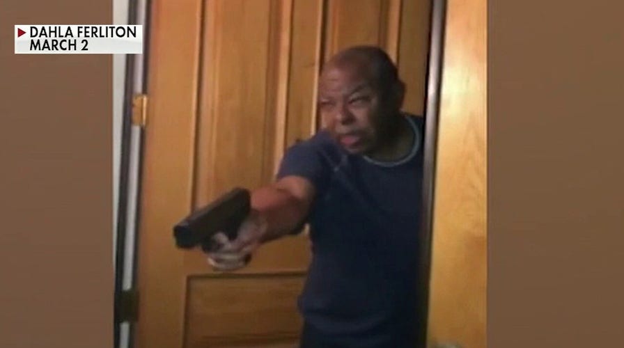 Husband of LA county district attorney charged after pointing gun at protesters