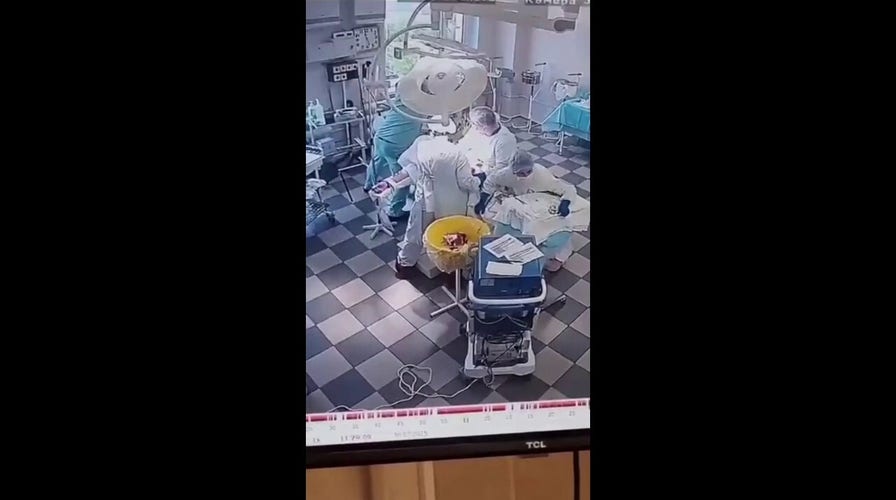 Russian doctors hold onto patient as earthquake hit during surgical procedure