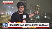 Sirens blare and rockets erupt over Tel Aviv