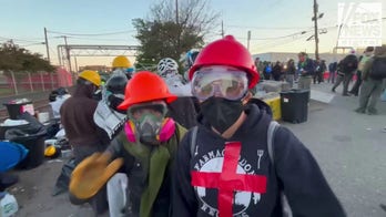 Agitators at Delaney Hall organize supplies before clashes unfold