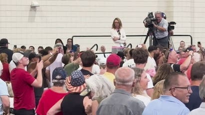 Protester removed by security during Trump speech