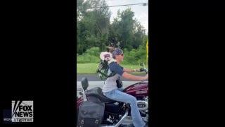 Dog rides on motorcycle with driver in hilarious video - Fox News