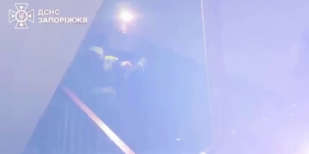 Ukrainian firefighters battle apartment building fires after overnight Russian strikes on city of Zaporizhzhia