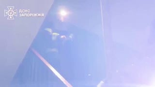 Ukrainian firefighters battle apartment building fires after overnight Russian strikes on city of Zaporizhzhia