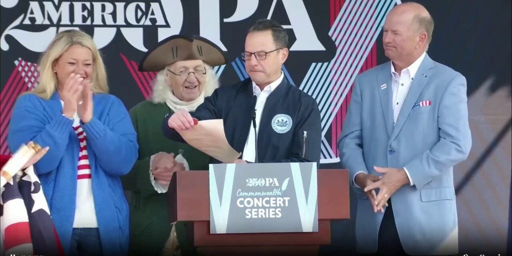 America250 backdrop crashes toward Gov. Josh Shapiro at announcement event